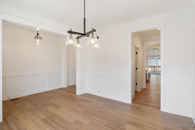 Photo represents the plan, not the actual home. Design selections may vary. The first floor offers open-concept living, featuring a formal dining and living room directly off of the foyer. | Image 6