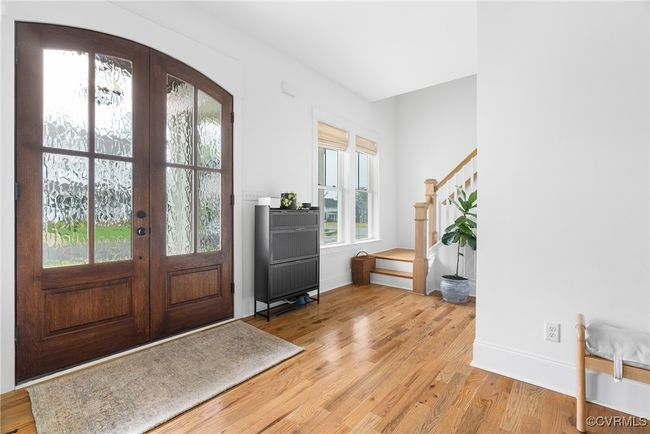 Foyer entrance featuring light wood-style flooring, french doors, stairs, and baseboards | Image 5