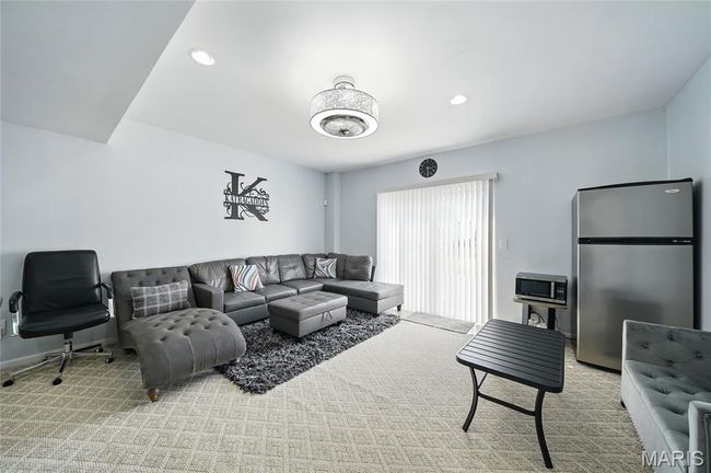 Carpeted living room with recessed lighting | Image 25