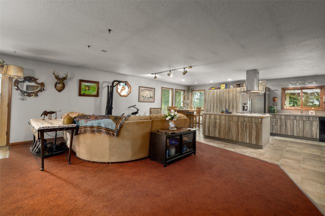 Living area featuring a textured ceiling | Image 34