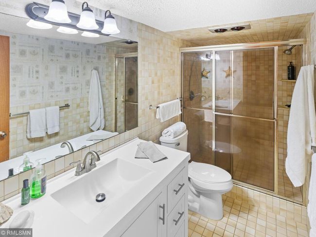 Lower guest bath with new vanity | Image 35