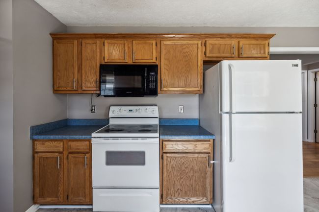 With all appliances provided including the fridge, durable laminate flooring, and a garbage disposal, meal preparation and cleanup are a breeze! 2095 Bolden Drive, Murfreesboro, TN 37127 | Image 11