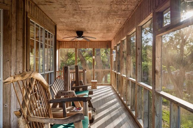 Indulge in outdoor living at its finest with an array of inviting patios thoughtfully positioned around the residence. These well-planned spaces, both screened-in and open-air, provide the perfect stage for year-round enjoyment. | Image 17
