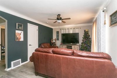 Living room featuring ceiling fan and hardwood / wood-style flooring | Image 3