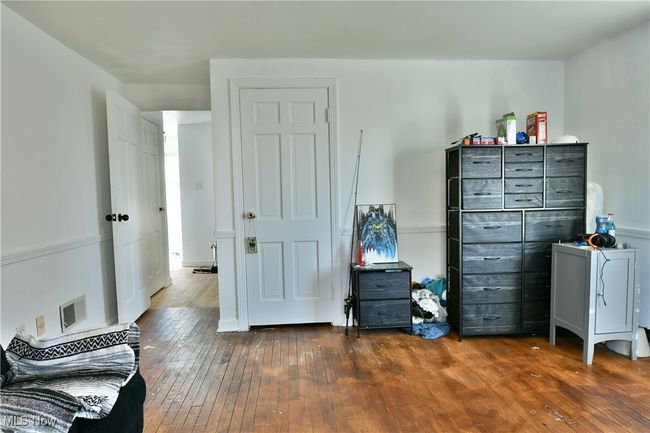 Bedroom with dark wood-style floors | Image 32