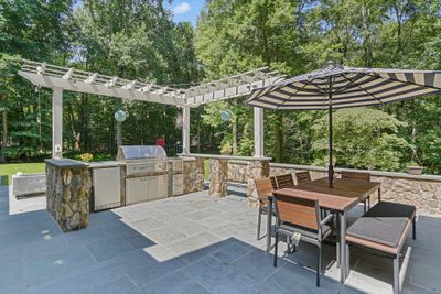 Incredible outdoor kitchen, TV, fire pit and entertainment area! | Image 3