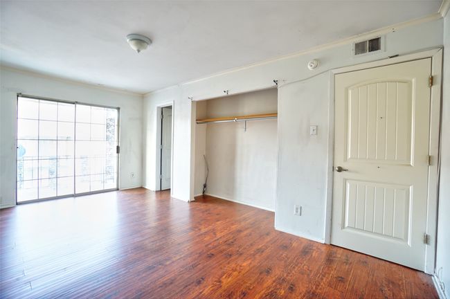 bedroom with full bath and balcony | Image 9