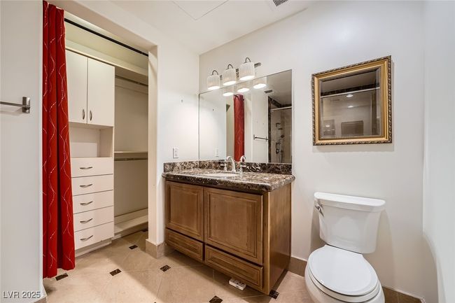 Full bath with vanity, toilet, a shower with curtain, and tile patterned flooring | Image 23