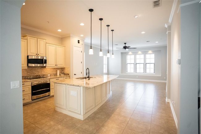Second floor main living, kitchen, and dining. | Image 11