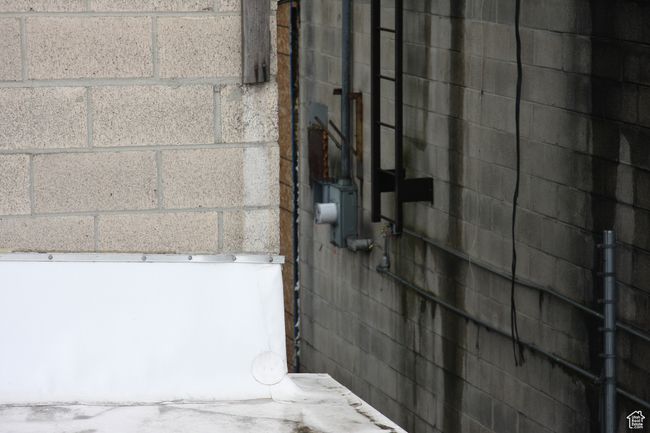 Bathroom with concrete block wall | Image 21