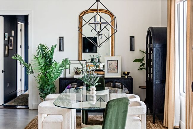 Dining area featuring a chandelier and concrete flooring | Image 8