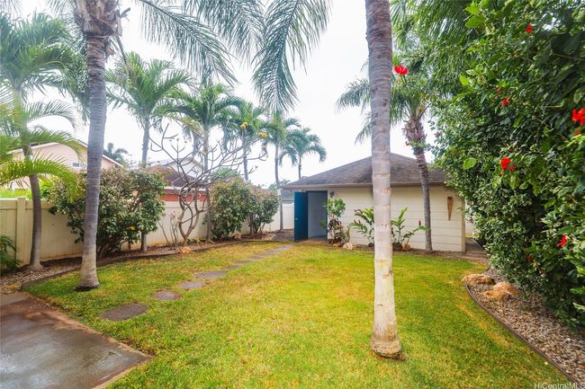 Backyard view from house to garage. | Image 5