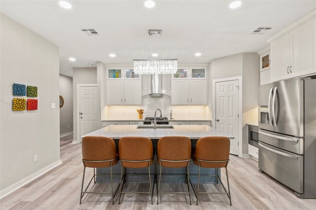 Stylish and functional with modern appliances and generous counter space for meal prep or entertaining. | Image 8