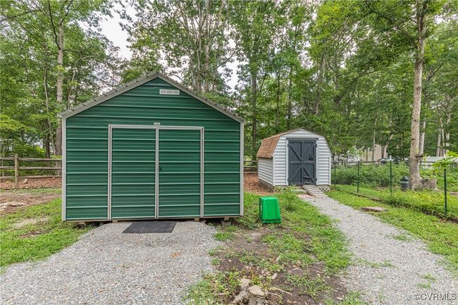 Garage featuring a storage unit | Image 30