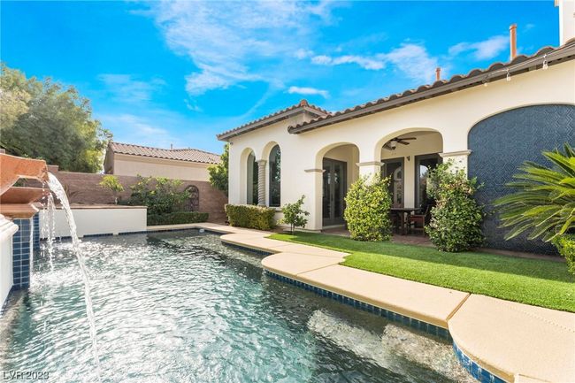 Pool features fountains and loggia to the right. | Image 15