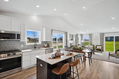 Picture of a model home with the same floorplan and similar features. Welcome to the Courtland kitchen | Image 3