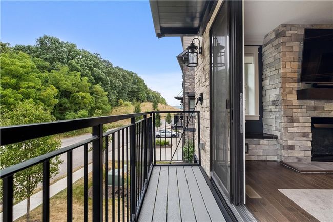 Main floor Living Room has sliding doors to a balcony. | Image 6