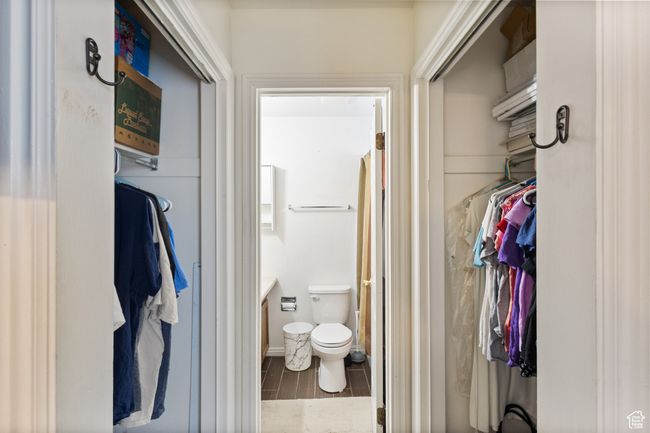 Full bathroom featuring wood finished floors, vanity, and a walk in closet | Image 15
