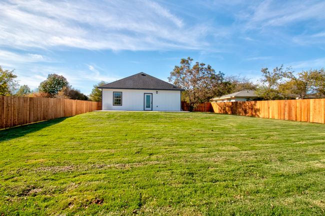 Back of house with a fenced backyard | Image 22