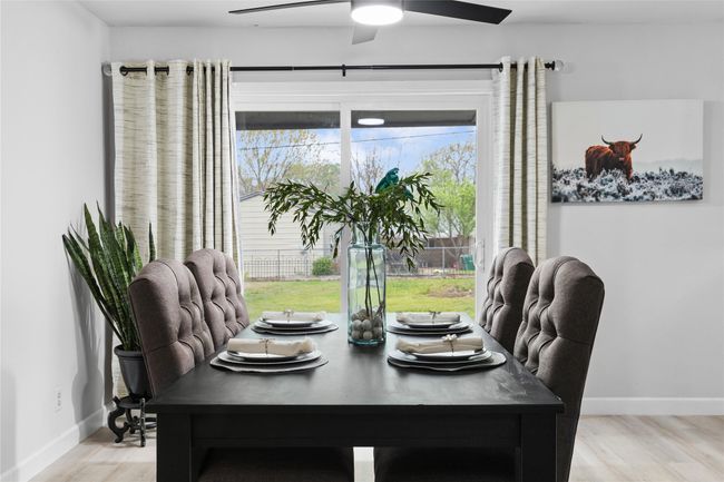 Dining space featuring ceiling fan, light wood-style flooring, and baseboards | Image 14