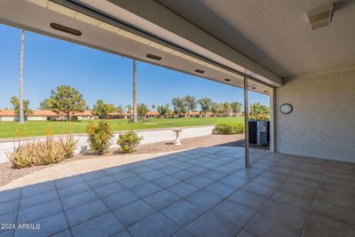 Covered north-facing patio with power security shutters. Views of No. 7 green and approach shots | Image 2