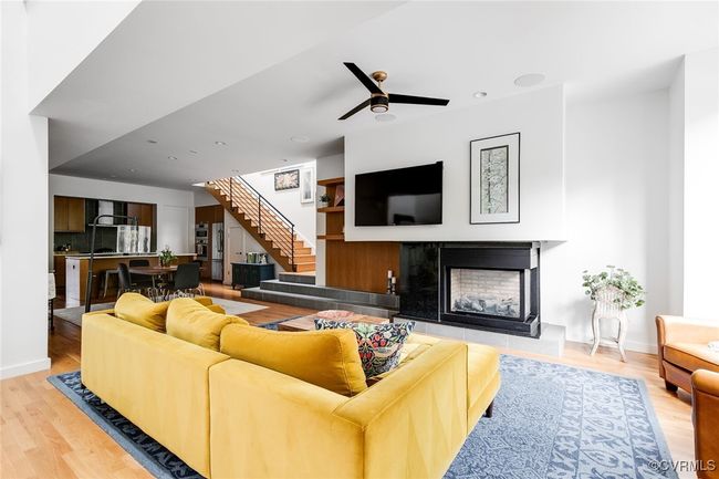 Step inside to discover an open concept floor plan with gorgeous hardwood floors. | Image 5