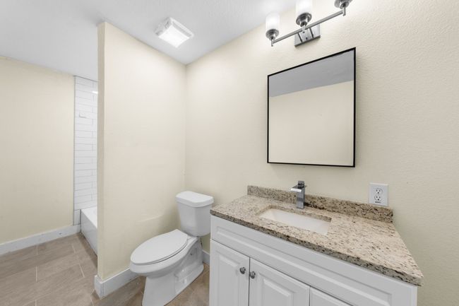 Full bathroom featuring vanity, toilet, and baseboards | Image 17