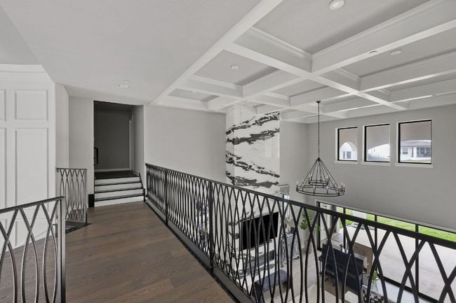 Hallway with beamed ceiling, an upstairs landing, wood finished floors, and coffered ceiling | Image 26