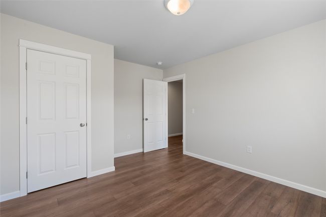 Unfurnished bedroom with baseboards and dark wood finished​​‌​​​​‌​​‌‌​‌‌​​​‌‌​​‌‌​‌​​​​​‌ floors | Image 53