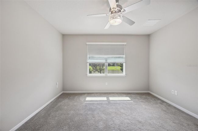 Primary Bedroom/Owners Suite overlooking beautiful views of serene backyard | Image 16