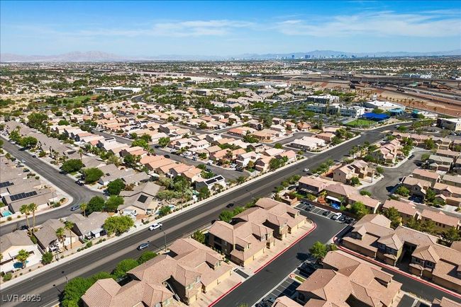 Aerial view of property and surrounding area featuring mountains and nearby suburban area | Image 46