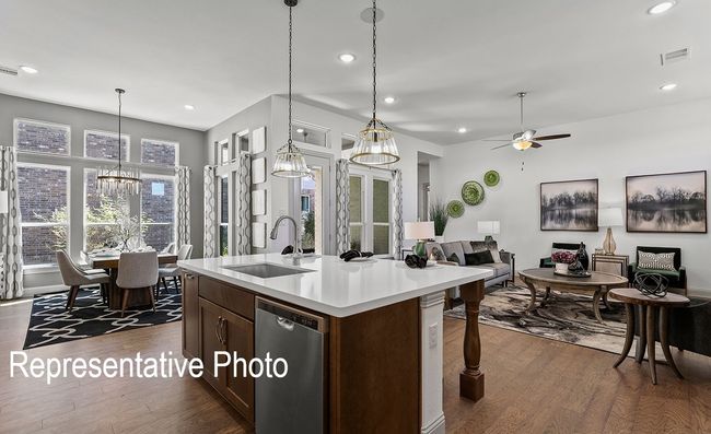 Kitchen featuring dishwasher, open floor plan, dark wood-type flooring, and recessed lighting | Image 5
