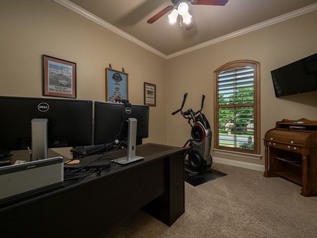 Office area featuring ornamental molding, carpet flooring, baseboards, and a ceiling fan | Image 28