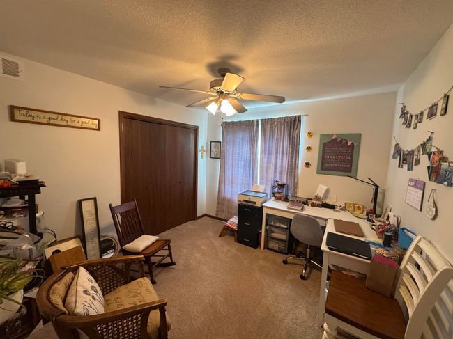 Office featuring a ceiling fan, light carpet, and a textured ceiling | Image 16