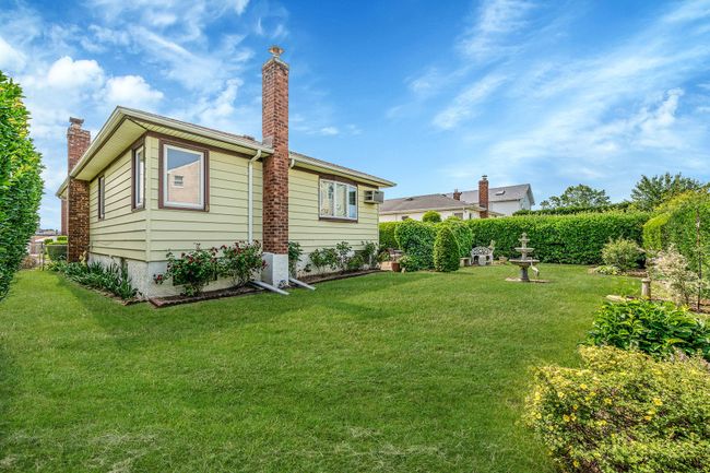 Back of house with a lawn and a chimney | Image 28