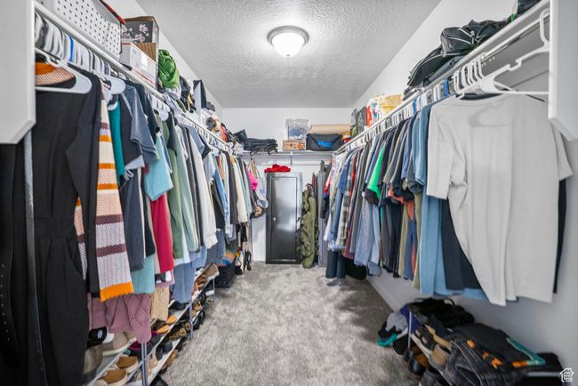 Spacious closet with carpet flooring | Image 13