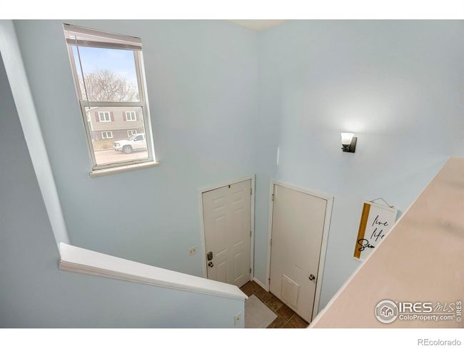Inviting bilevel entryway with a bright and open design. | Image 4