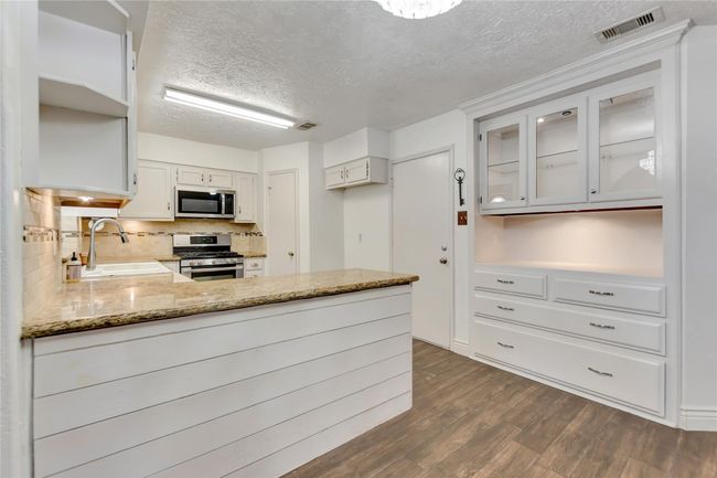 View of kitchen w/ built-in china cabinet | Image 5