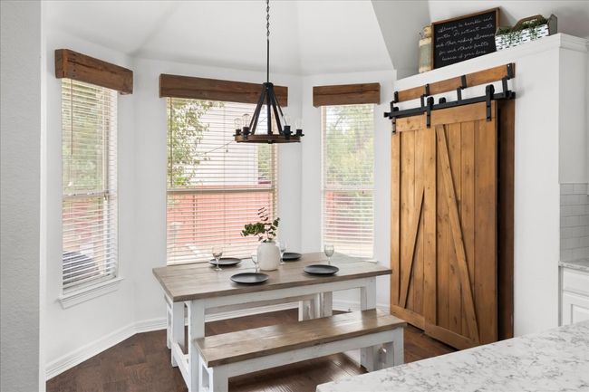 Love the sliding door to the pantry that ties the space together. | Image 10