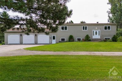 Experience rural tranquility & modern functionality in this beautifully well maintained 3+3 bedrm & 3 full bath home. | Image 2