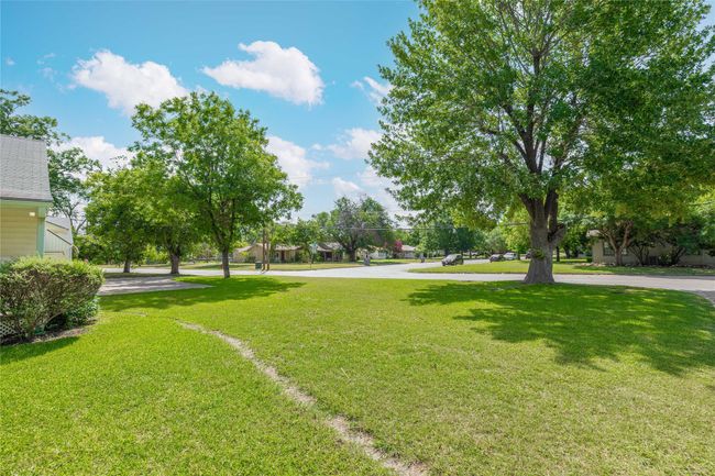 Front yard with view of green St. Augustine grass. City of Brownwood moved the water meter from backyard to front yard so there is a small trench line filling back in with grass. | Image 6