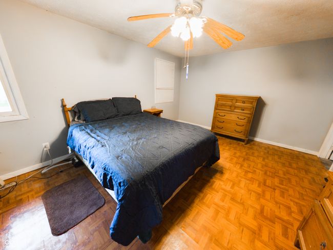 bedroom with baseboards and a ceiling fan | Image 10