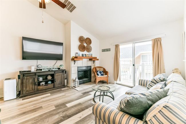 The unit features a fireplace for those crisp Autumn and Winter nights. | Image 5