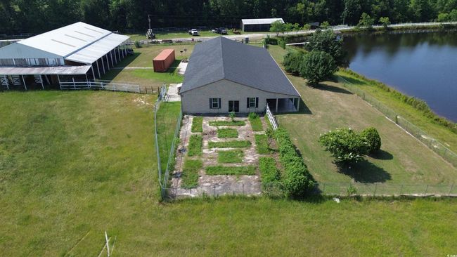 Aerial view of property and surrounding area featuring a large body of water | Image 4