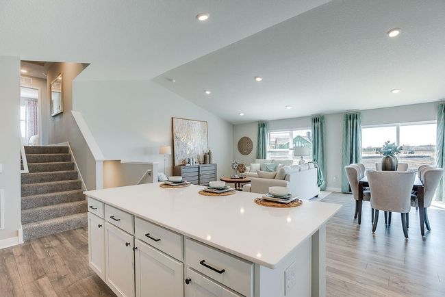 Just 8 steps up and 8 steps down from the main level to 4 bedrooms, 3 bathrooms, and a spacious lower-level rec room! Photo of model home, colors and selections shown may vary | Image 5