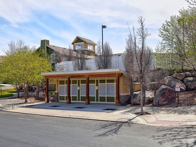 View of front facade with fence and stone siding | Image 35