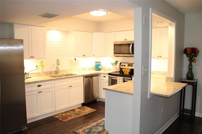 New kitchen and all matching Whirlpool stainless steel appliances. | Image 6