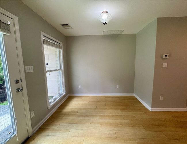 Unfurnished dining area with plenty of natural light and light wood-style flooring | Image 10