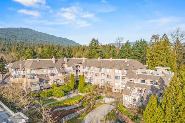 Birds eye view of property featuring a mountain view and a view of trees | Image 32