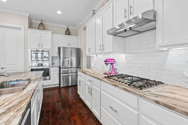 Whether hosting a dinner party or enjoying a quiet breakfast, this kitchen is ready to impress. | Image 8